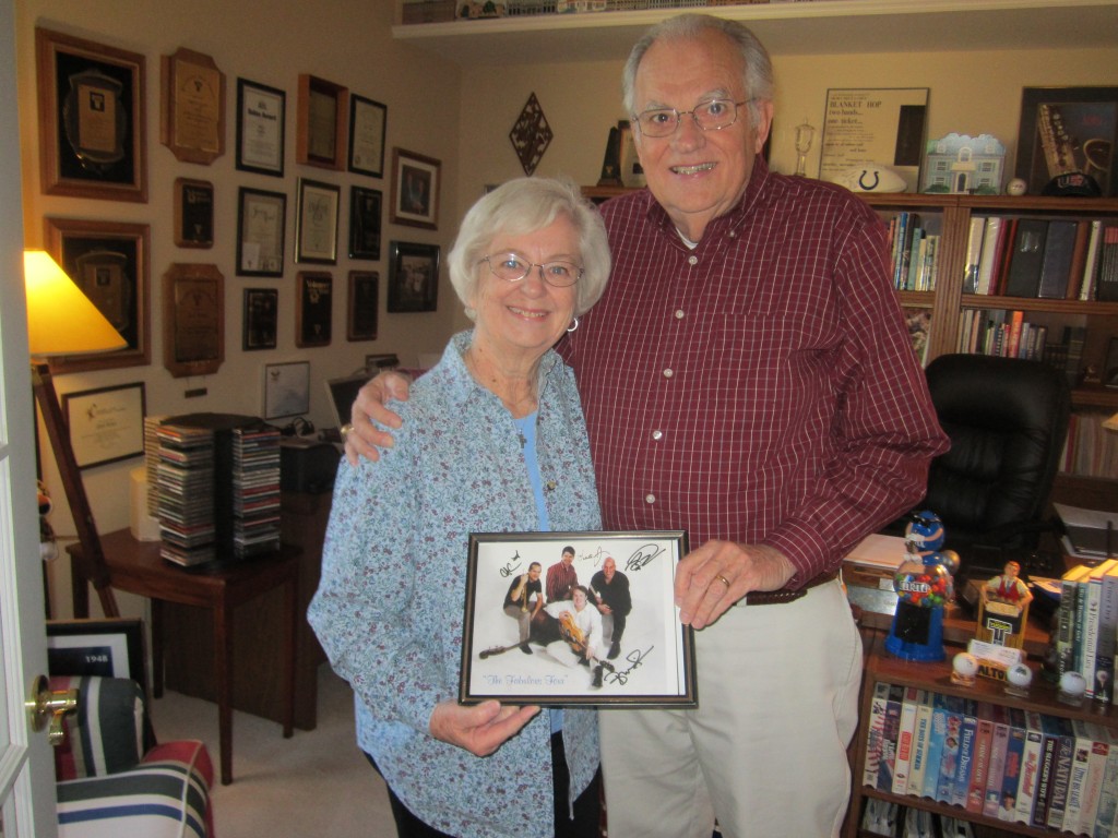 Fishers residents Neil and Sara Lou Lantz in their home with a picture of the new members of the jazz band "Four Freshmen." Neil is president of the board of directors for the Four Freshmen Society. (Photo by Nancy Edwards)