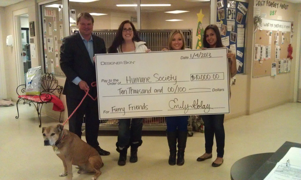 From left: Scott Matthews of New Sunshine, Humane Society for Hamilton County Executive Director Rebecca Stevens, and Emily Golay and Hillary Hammond of Designer Skin. (Photo provided by Humane Society of Hamilton County)