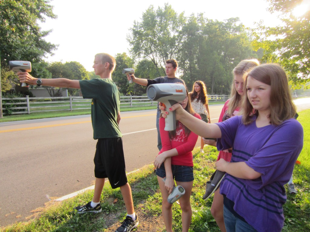 The physics class uses rader guns to check car speeds as part of a class lesson. (Submitted photo)