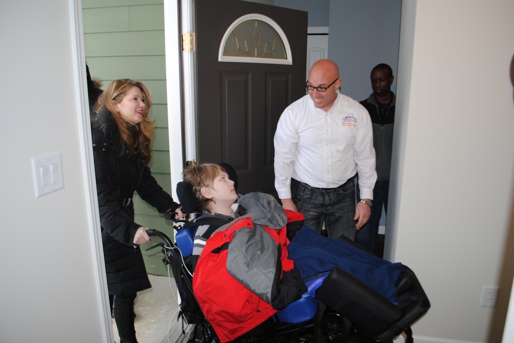 y and Jackson Miller were welcomed into their new home by Samantha’s House Executive Director James Keller.