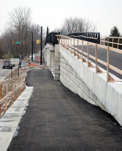 Handrails, a second layer of asphalt and a little site work are needed to finish the Monon Pedestrian Bridge on 146th Street. (Photo by Robert Herrington)