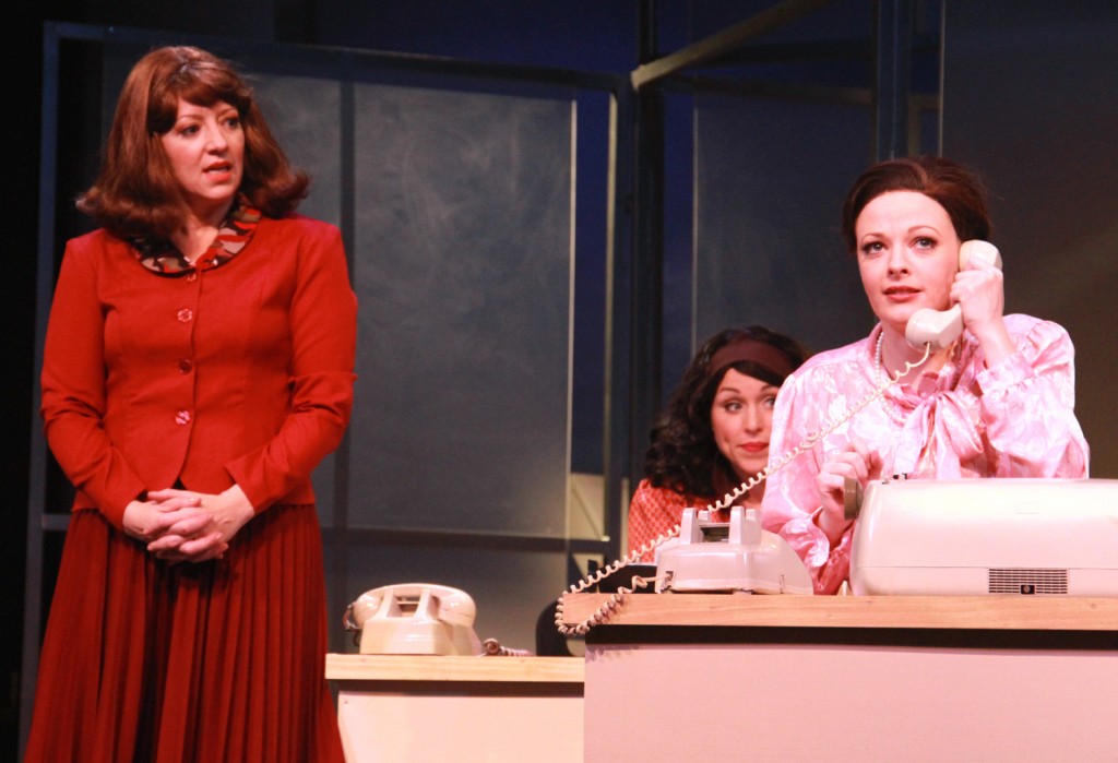 Violet Newstead (Annie Edgerton), left, is concerned as new employee Judy Bernly (Sarah Hund) frantically tries to answer the phone in 9 to 5, The Musical.