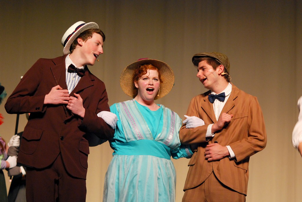 Cornelius Hackl (Craig Thompson), Dolly Levi (Anna Christianson) and Barnaby Tucker (Nathan Fauntleroy) sing “Put on [their]Sunday Clothes” and board a train to New York. (Photos by Robert Herrington)