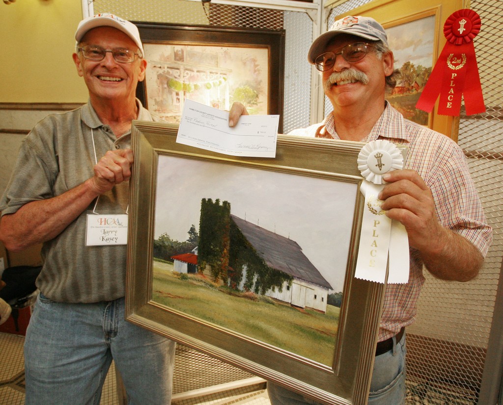 Larry Kasey, HCAA treasurer and Gathering chairman, left, recognizes Rodney Reveal as winner of the $600 Prize of Distinction during the HCAA’s fourth annual Gathering of plein air painters. (photo submitted)