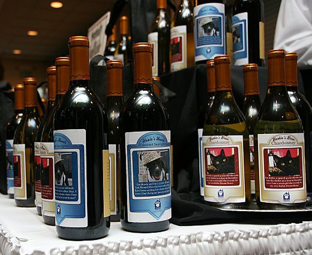 The wine bottles received new names and labels (like Howie’s Hooch) honoring a cat and dog available at the Humane Society of Hamilton County.