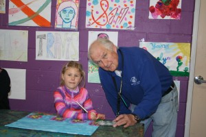 Addison Snyder with Bill Moore in front of the Name in Lights Wall at the Boys & Girls Club of Zionsville (Club East).