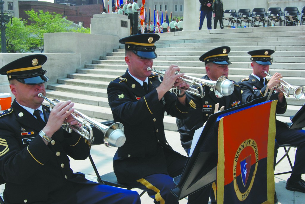 Fishers resident Sgt Rod Pippenger (seated center) plays the trumpet as a member of the 38th Infantry Division Army Band. (photo by Karen Kennedy)