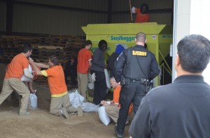 Hamilton County inmates and probationers work together to replenish the county’s depleted supply of sandbags.