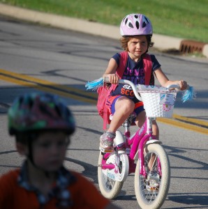 Mac Whitesell rides her bike to Washington Woods Elementary School on Grassy Branch Road.