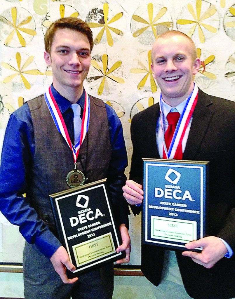 Steven Johnson, left, and Noah Roush display their first place plaques in Marketing Communications from the state DECA competition. (Photo provided)