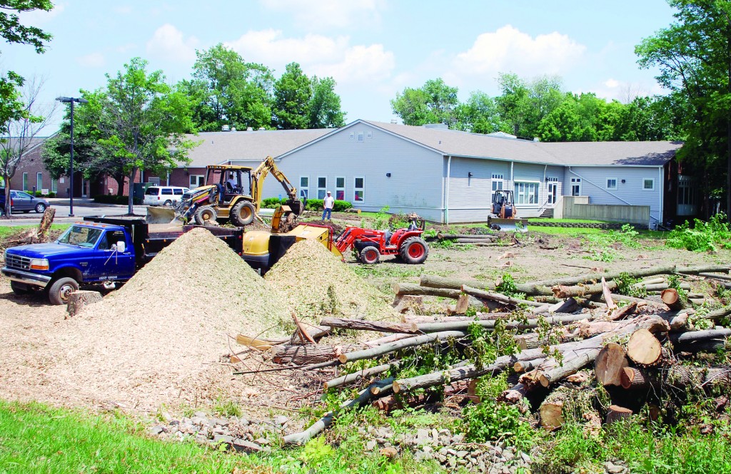 Construction workers begin clearing trees for the area of the addition at Westfield Washington Public Library. (Photo by Robert Herrington)