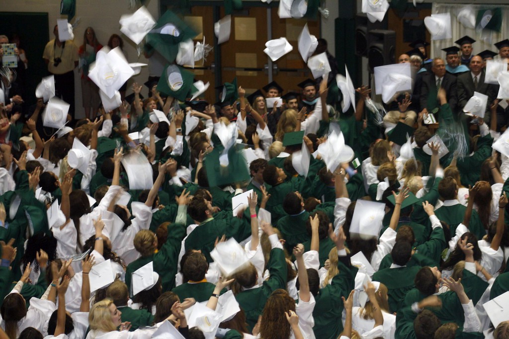 Following the conclusion of the commencement ceremony, seniors throw their caps into the air to celebrate graduation.