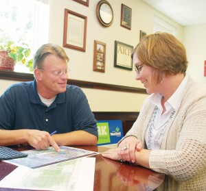 Westfield Economic and Community Development Director Matt Skelton looks over plans with Assistant Director Jennifer Miller in his office. (Photo by Robert Herrington)