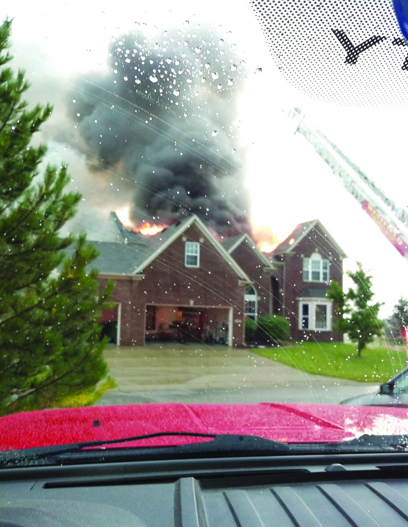 Westfield firefighters fight rain and flames at a residential fire at 16127 Etna Green on June 23. (Photo submitted)