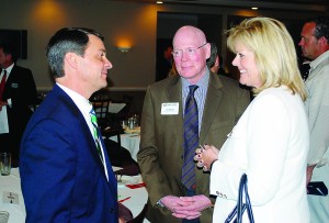 From left: Indiana Secretary of Commerce Victor Smith talks with Hamilton County Alliance President Tim Monger and Noblesville Economic Development Director Judi Johnson following his speech to the Noblesville Chamber of Commerce on July 24.
