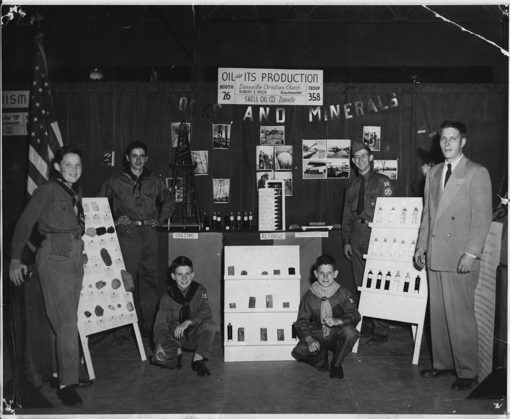 Scoutmaster Robert Knox (right) and scouts from troop 358 show a display on Oil and its Production. (Submitted photo)