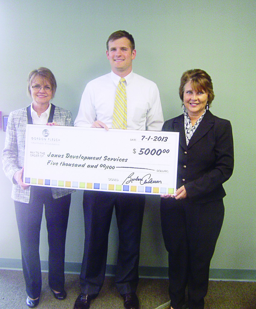 From left, Debbie Laird, vice president of development and transportation at Janus, Patrick Ritchie, of the Gordon Flesch Co., and Connie Sanders, president/CEO of Janus proudly present a $5,000 grant to support the Janus Doorways program. (Submitted photo)