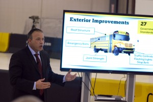 IMMI Vice President James Johnson provides background about the traditional school bus at the SafeGuard: School Bus Safety 101 event. (Photo by Robert Herrington)