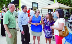 From left: Rob Garrett, Dave Weiss, Becky Weiss, Kristin Weiss and Nicki Felix enjoy a conversation dur- ing the inaugural “Party on the Patio” in downtown Westfield. (File photo by Rob Herrington)