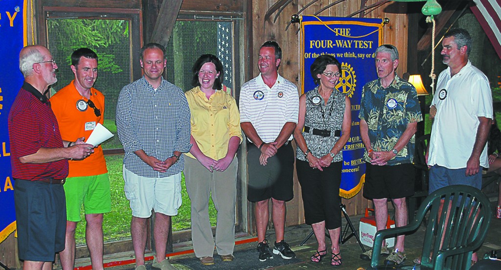 From left: Former Westfield Rotary Club President Bruce Watson installs new President Ryan Rothacker, President-Elect Eric Bell, Secretary Courtney Knies and Directors Jim Dahl, Cindy Olson, Chuck Lehman and Barry Ginder at Mic and Jill Mead’s Acorn Farm. (Submitted photo)