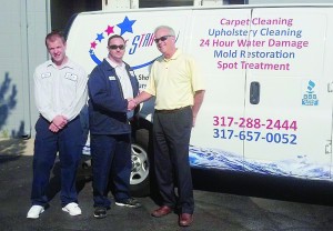 From left: Alex Miller, James Caldwell and Mayor Andy Cook at Five Star Restoration's ribbon cutting.