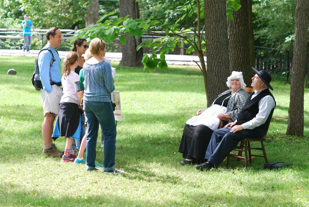 Ambrose (Rich Steinberg) and Elizabeth Osborne (Kate Hinman) share with a Voice from the Past group last year about what it was like to settle in Westfield in 1834. (Photo by Robert Herrington)