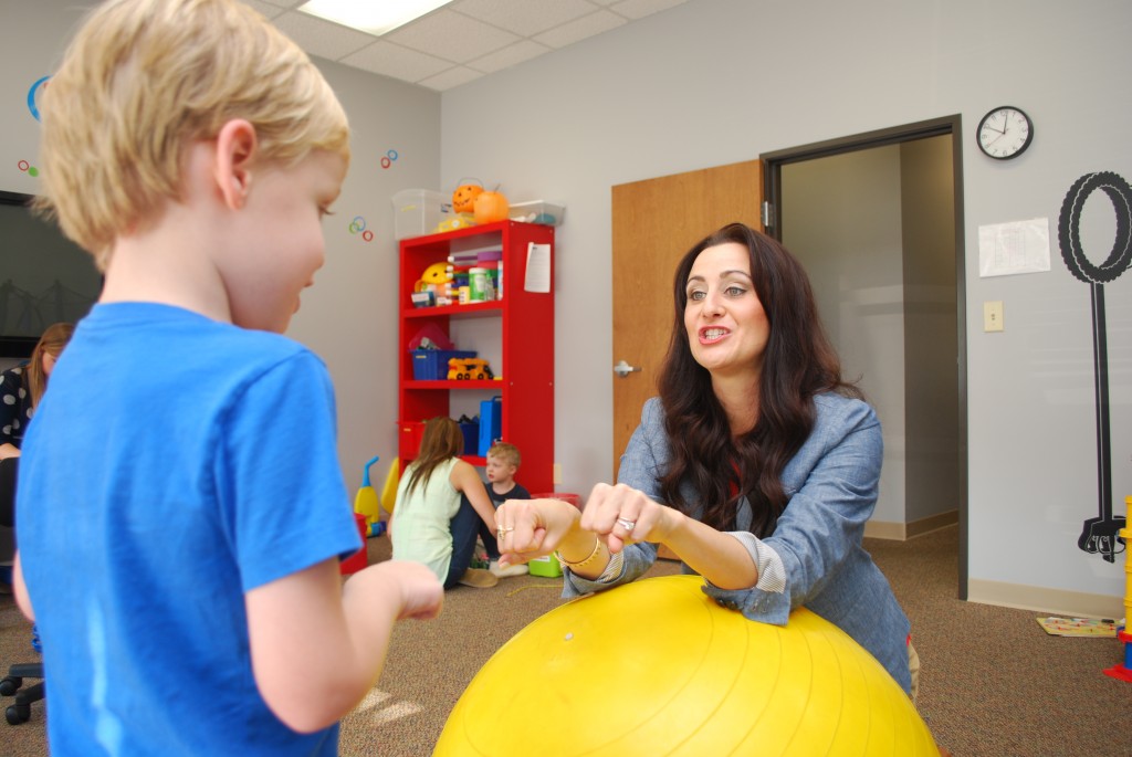 Courtney Bierman works with Crew on his sign language inside the playroom of Bierman ABA Autism Center. The center has just broken ground for a larger facility in Westfield. (Photo by Robert Herrington)