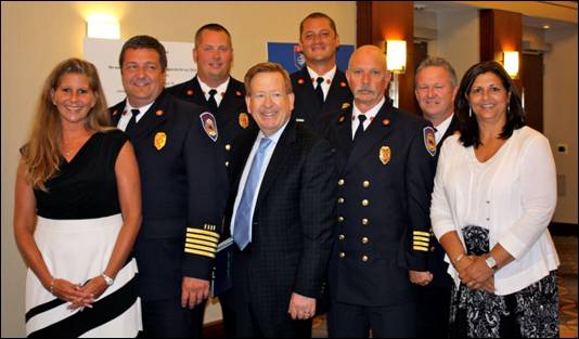From left: Accreditation Manager Denise Snyder, Fire Chief Matt Hoffman, Section Chief Adam Harrington, Mayor Jim Brainard, Training Chief Steve Frye, Assistant Chief Bob Hensley, Captain Orbie Bowles, and Executive Division Manager Jean Junker at the accreditation ceremony in the Swissotel in Chicago. (Photo submitted)