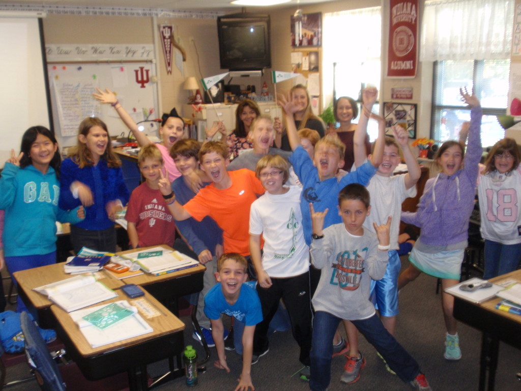 Fourth-graders at Eagle Elementary School working on their year-long interdisciplinary program, “The Great Ape Project,” learn that they will be going to the Cincinnati Zoo. Teachers Jayne Shubat, Beth Brent and Kelly Masters celebrate being awarded a grant from the Zionsville Education Foundation with their students.