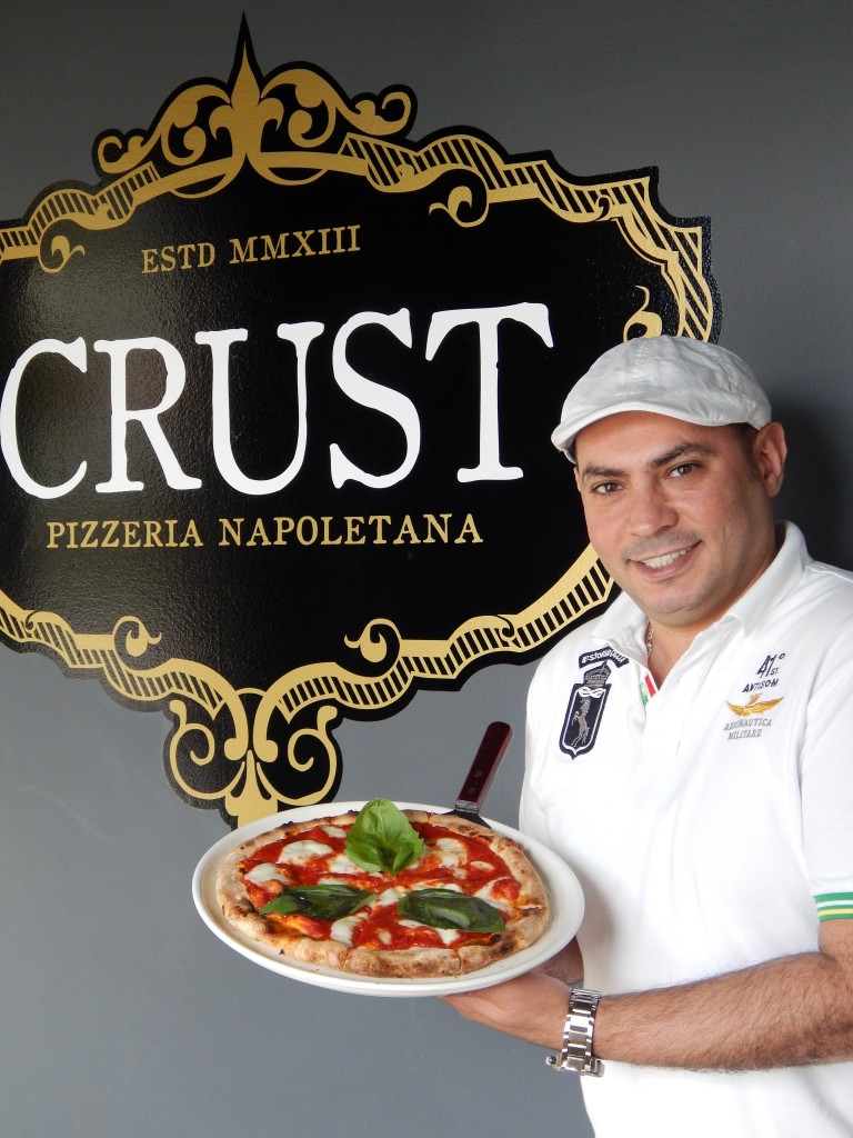 Chef/Owner Mohey Osman with his signature Margherita pizza. (Photo by Karen Kennedy)