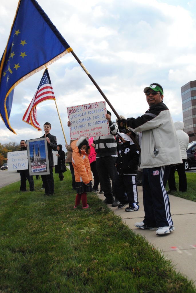 Marchers with Campaign for Citizenship encouraged U.S. Rep. Susan Brooks to support a path to citizenship for undocumented Indiana residents outside her Carmel office on Nov. 1. (Staff photo)
