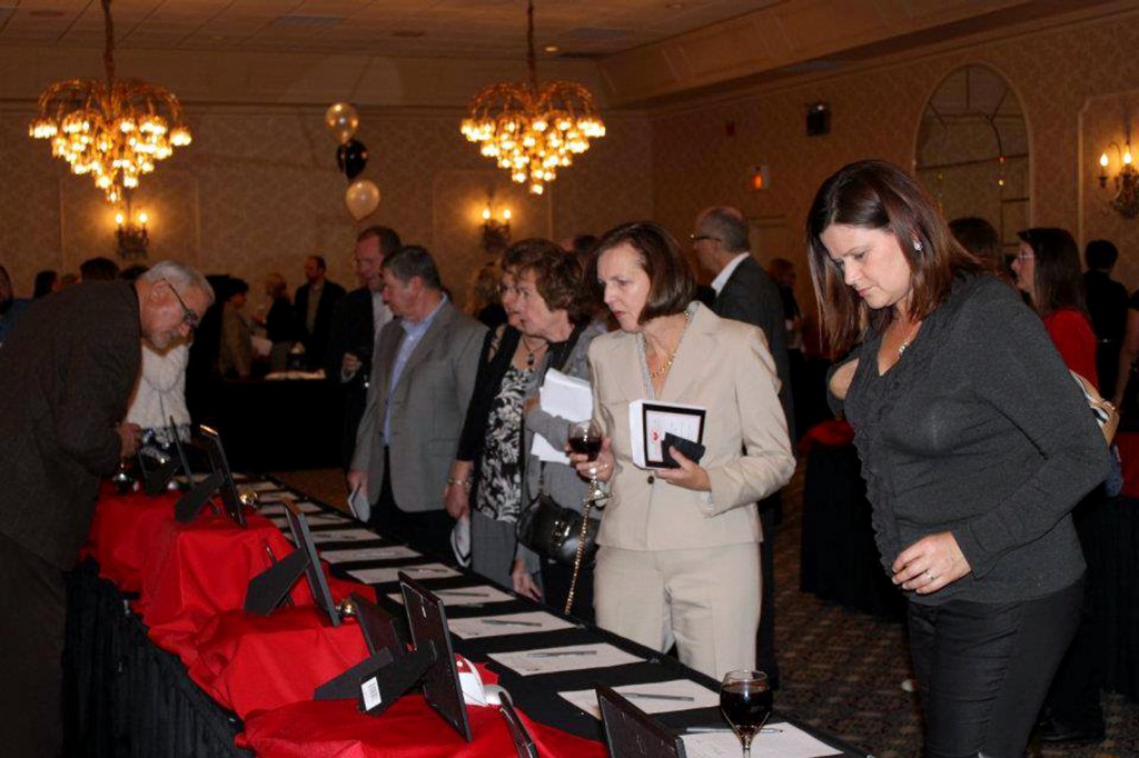 Guests of last year’s Tinsel & Tails Holiday Petacular take a look at the various silent auction items. This year’s event is 6 to 10 p.m. Nov. 21 at Ritz Charles in Carmel. (Submitted photo.)