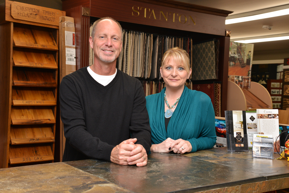 Kent and Tara Claghorn, owners of Claghorn Custom Flooring, on First Street in downtown Zionsville. (photo by Dawn Pearson)