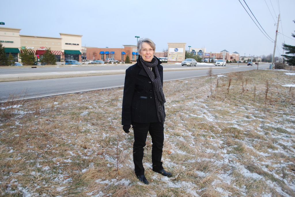 Jeannine Fortier (pictured) and other members of the Spring Mill Station Study group are creating a master plan for undeveloped land at the three remain- ing corners of Spring Mill Road and 161st Street. (Photo by Robert Herrington)