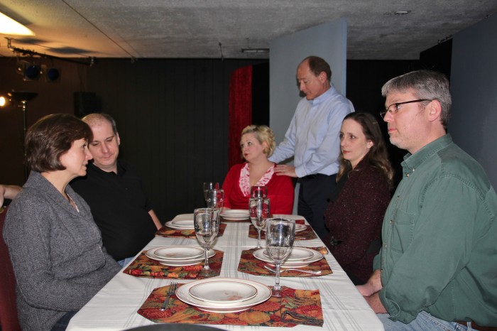 A family helps its aging mother through Thanksgiving dinner in a scene from “The Dining Room.” From left, actors Barb Weaver, Ryan Shelton, Sonja Distefano, Mark Tumey, Tonya Fenimore and Daniel Shock (submitted photo)