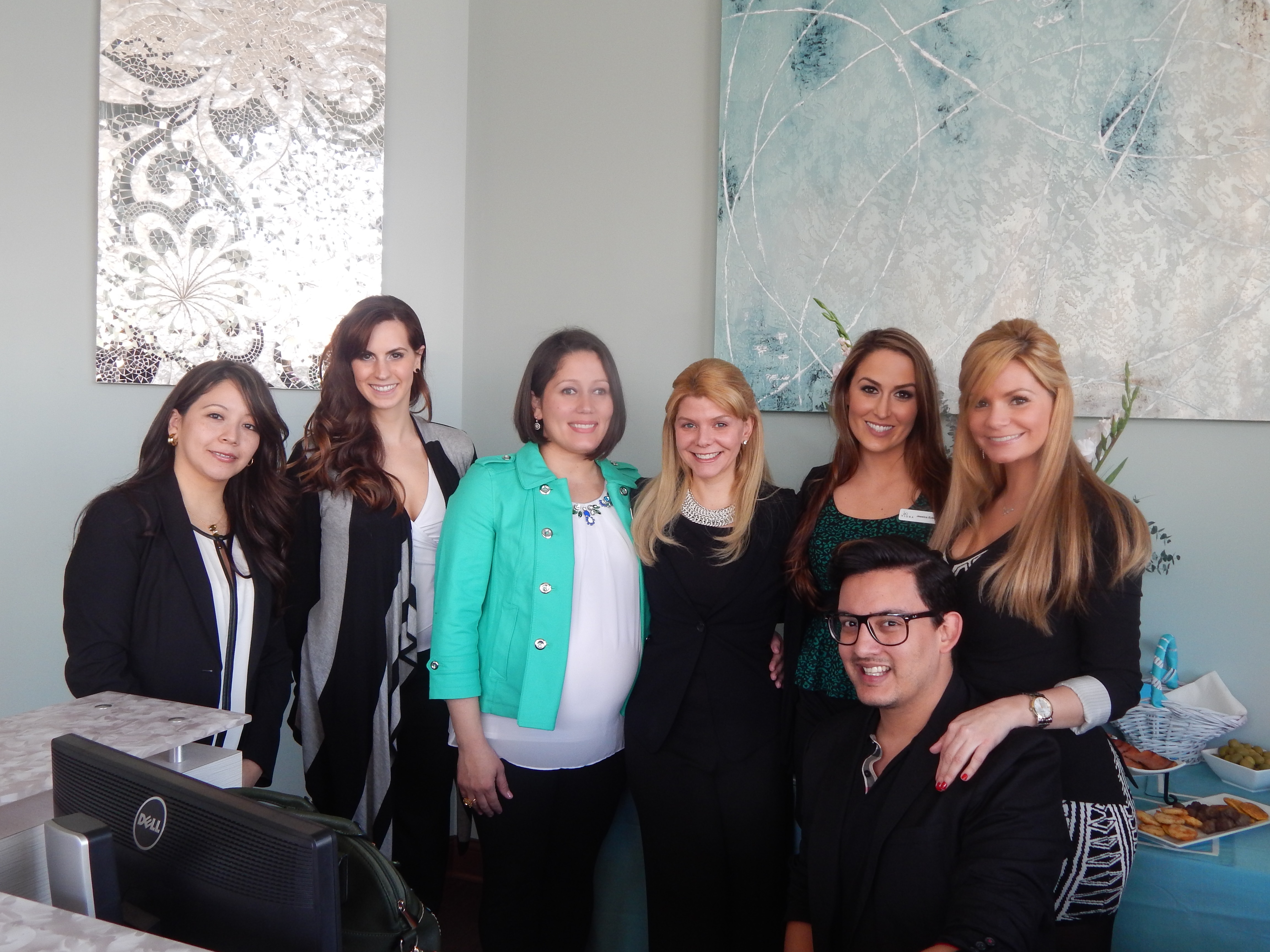 The team at Vitto Dental Spa, from left: Lucy Snider, Megan Ernstberger, Vanessa Bertoni-McElroy, Dr. Andreina Vitto, Jessica Eckles (from Viora Med,) Alex Paredes (kneeling) and Patricia Vitto. (Photo by Karen Kennedy)