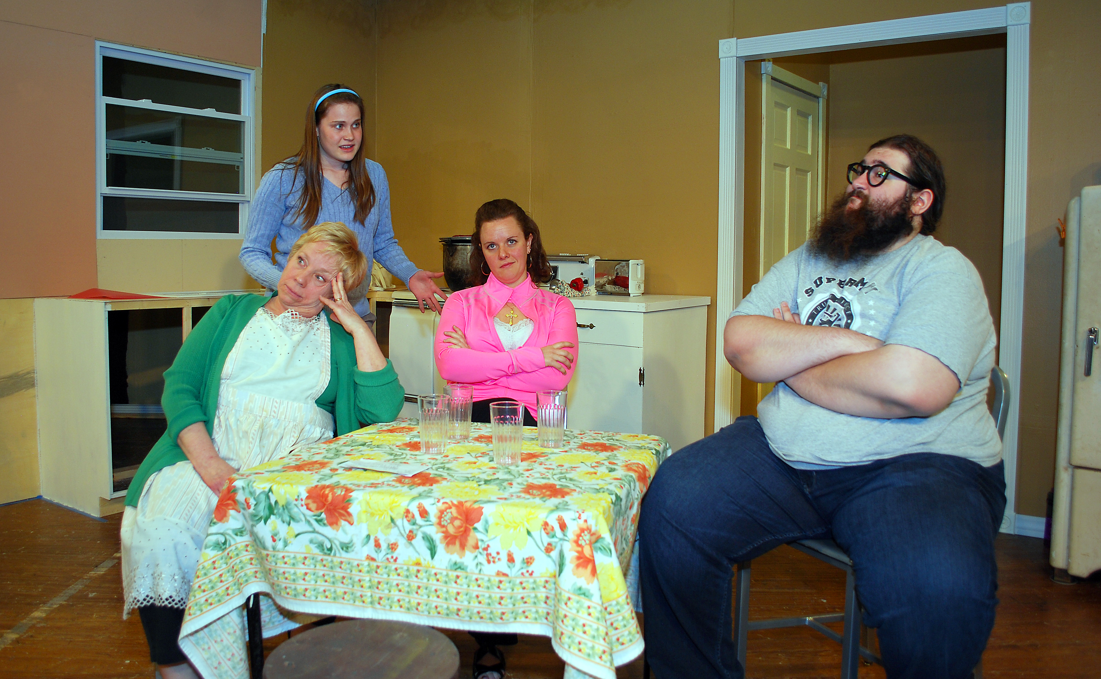 From left: Diann Ryan (Clara), Becca Wenning (Ruth), Kelly BeDell (Beverly) and Stefan U.G. LeBlanc (Jimmy) play the dysfunctional but loving Nowak family in “Miracle on South Division Street.” For more photos of the play, visit youarecurrent.com. (Photo by Robert Herrington)