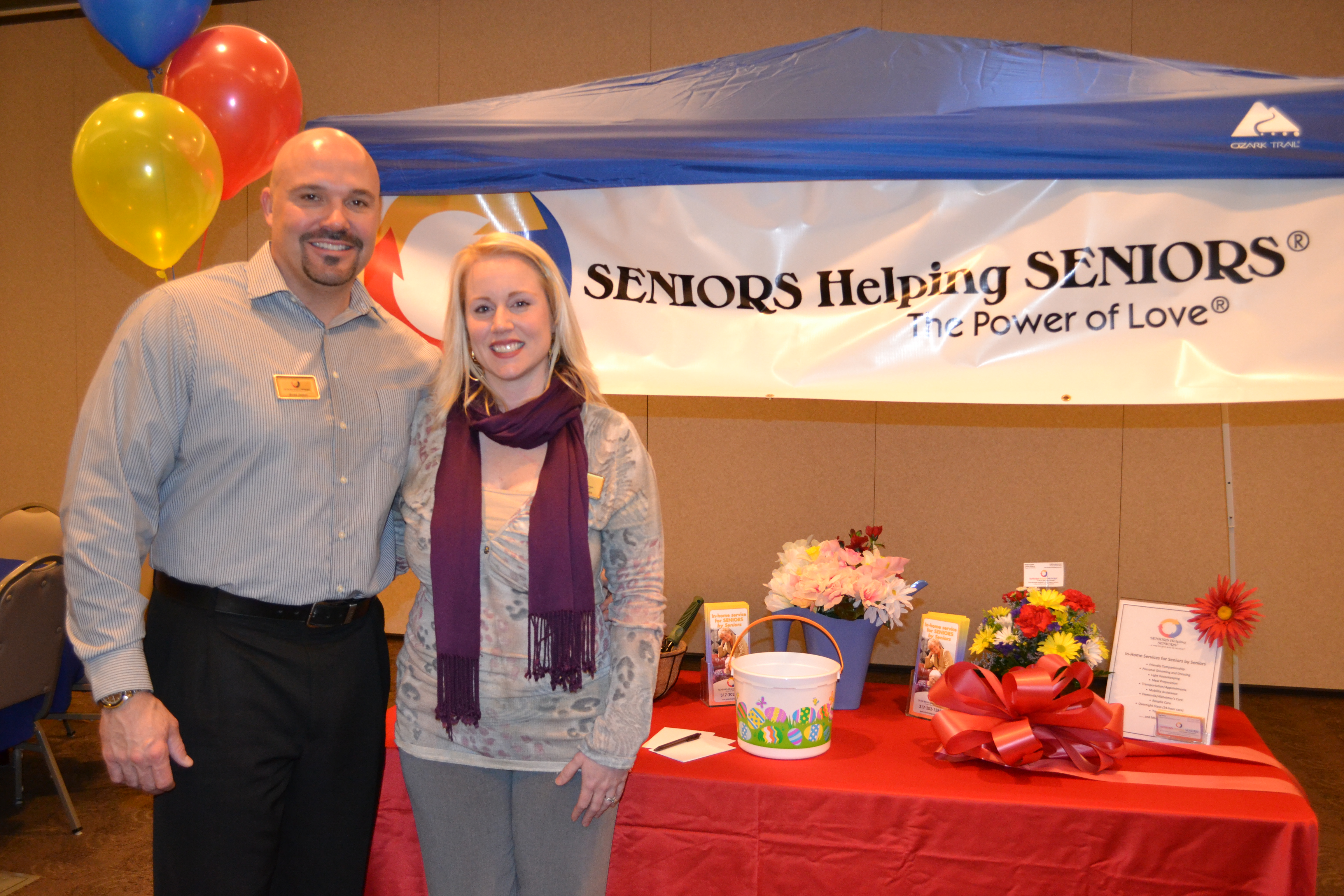 Brad and Christina James, owners of Seniors Help- ing Seniors, at a ribbon cutting for their business