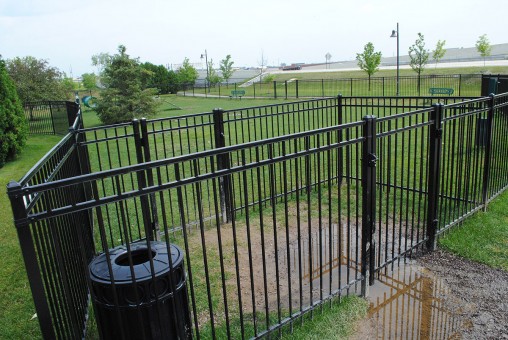 The dog park at Clay Terrace Mall recently installed a double gate to prevent dogs from escaping when others enter the park. (Staff photo)