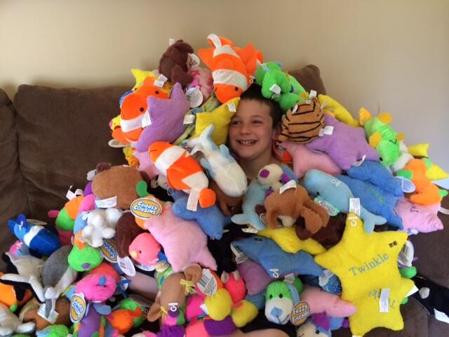 9-year-old Hudson Miles with the stuffed animals he donated to the Fishers Fire Department.