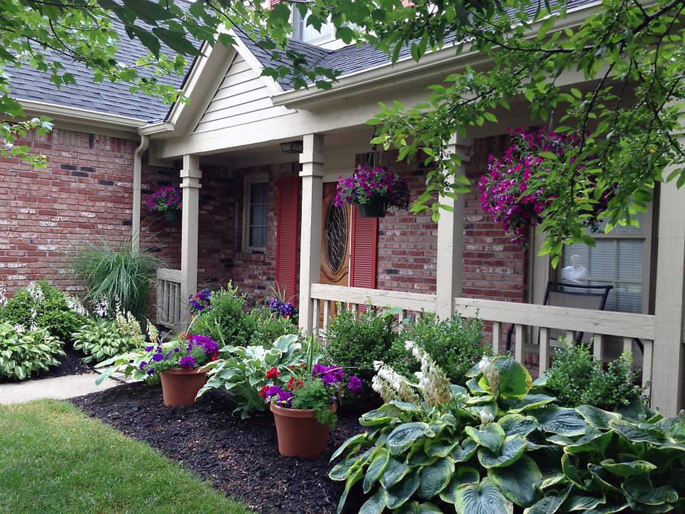 Mark and Brenda Jordan of 14601 Beacon Blvd. won the “Best Front Porch” category during last year’s floral competition, which had purple as its dominant color. (Submitted photo)