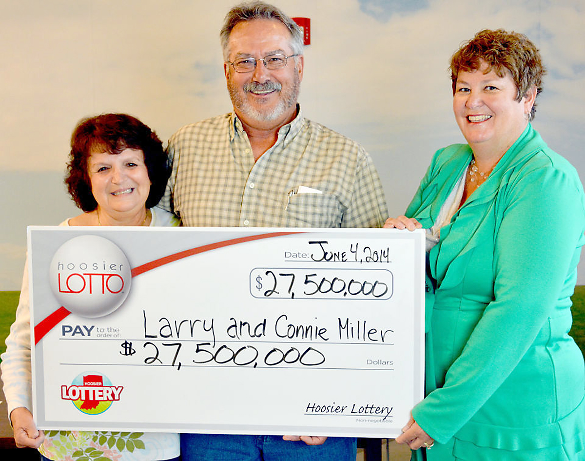 Hoosier Lottery Executive Director Sarah Taylor, right, presented Larry and Connie Miller with their $27.5 million jackpot winnings on June 4. (Submitted photo)