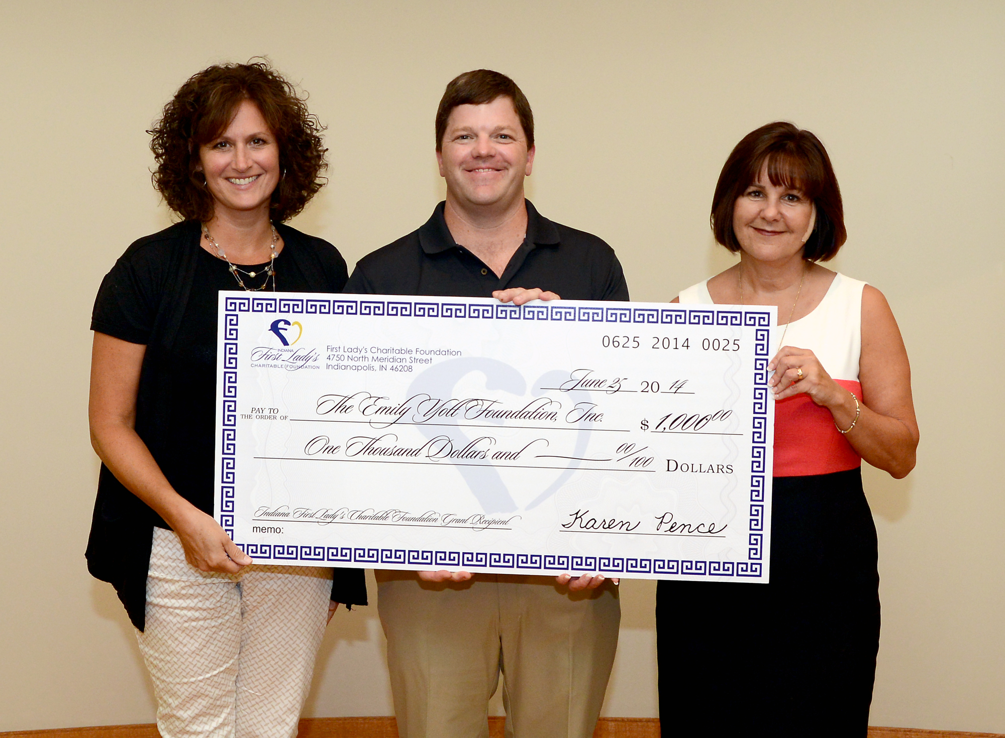 From left: Stephanie and Jim Yott of Westfield receive a $1,000 grant from First Lady Karen Pence at the Governor’s residence. (Submitted photo)