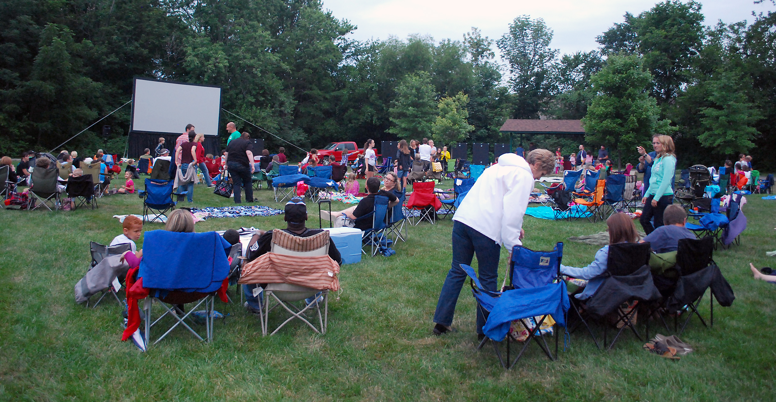 Community members prepare their seats and await the start of “Brave” at Asa Bales Park during last year’s inaugural movie series kickoff. (File photo by Robert Herrington)