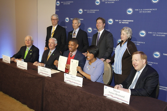 Mayor Jim Brainard (right) sits with the special task force for climate change. (Photo courtesy of the Associated Press)