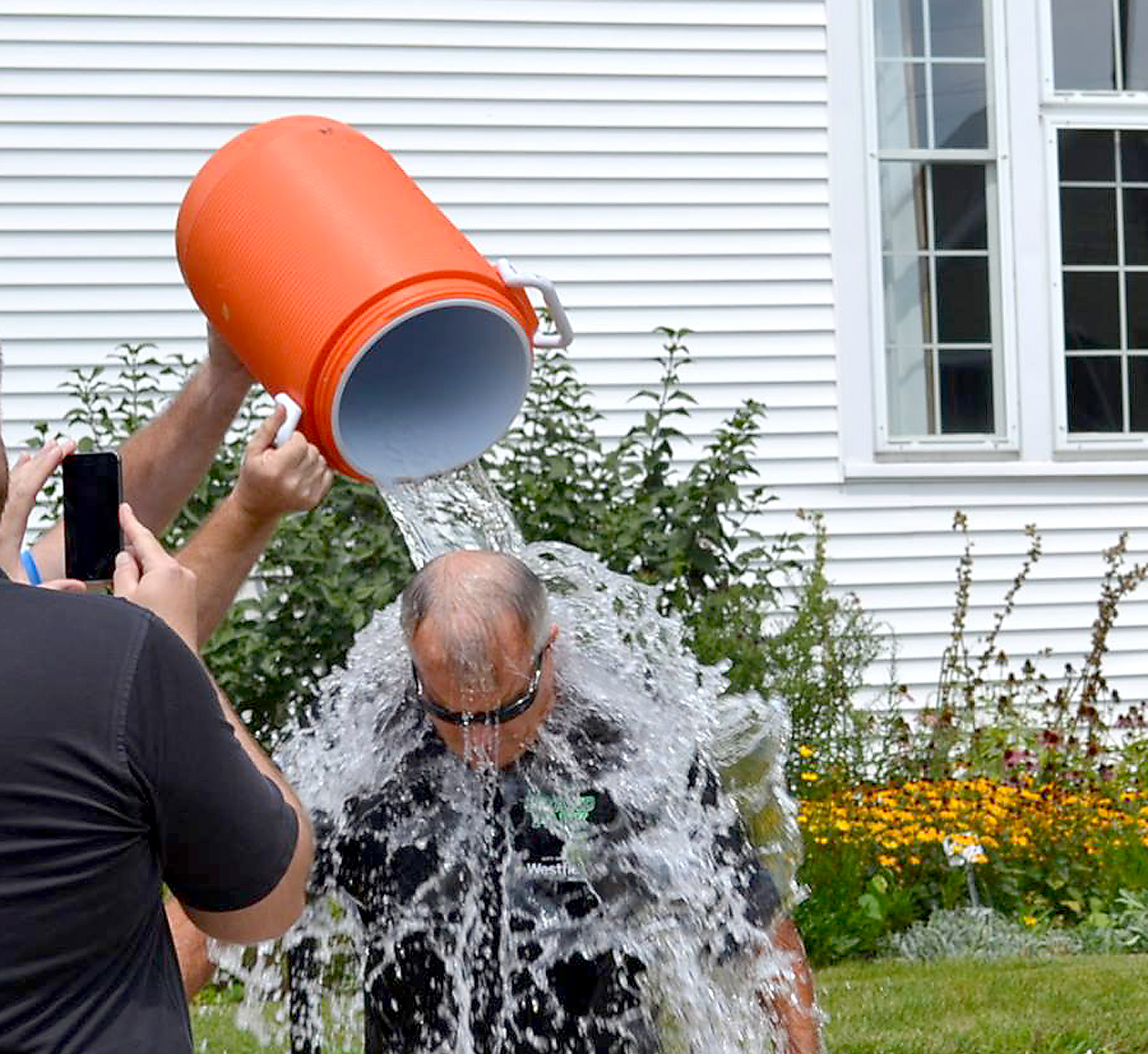 Mayor Andy Cook gets a bucket of ice cold water poured on him outside of Westfield’s City Hall as he participates in the ALS Ice Bucket Challenge on Aug. 19. (Submitted photo)