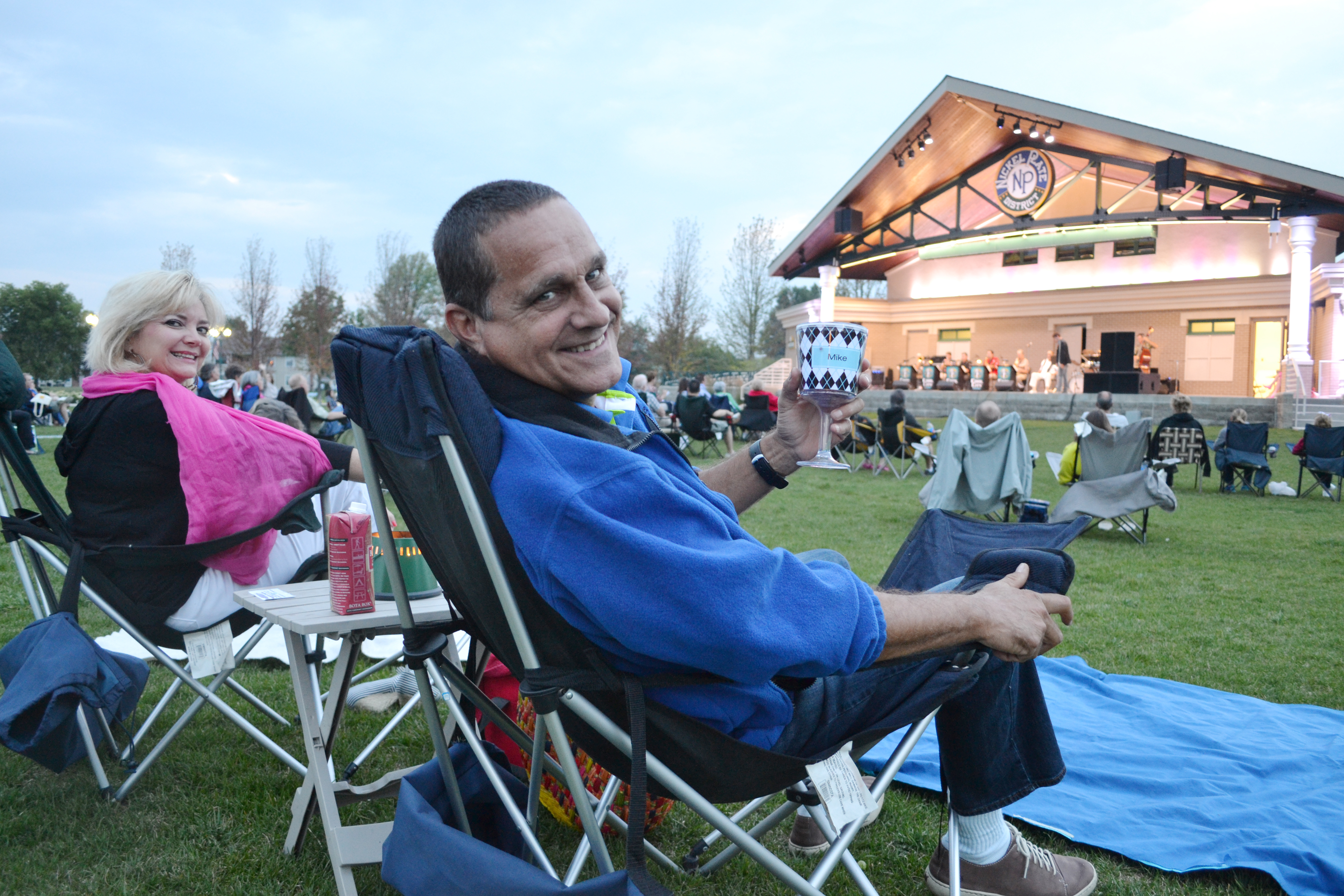 Mike and Janet Harris of Indianapolis enjoyed a picnic dinner and an evening of music at Fishers’ Amp After Dark Concert Series Aug. 1. (Photo by John Cinnamon) Amp After Dark i