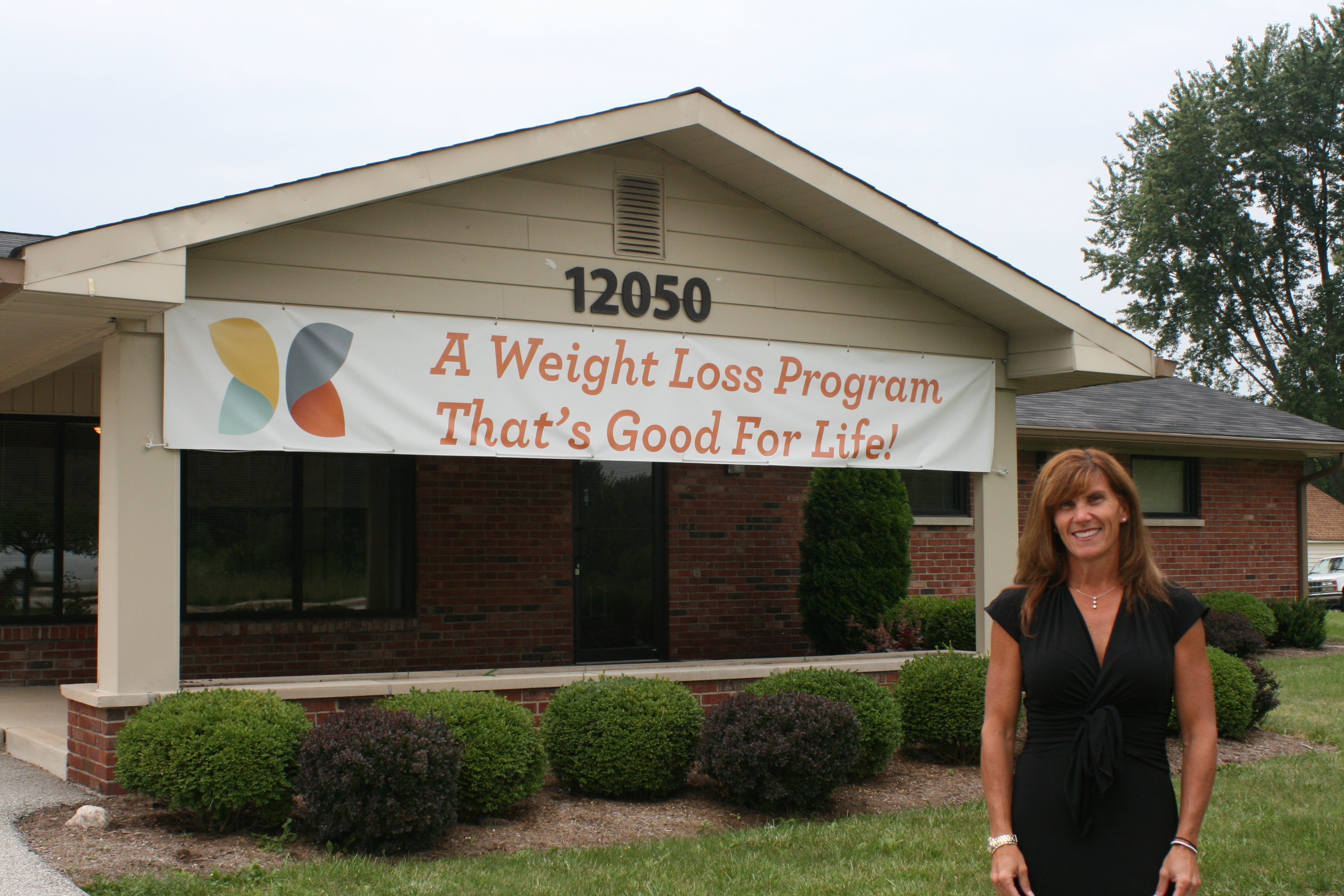 Owner and founder of Live Light Dr. Christy Kirkendal-Watson stands in front of her new office. (Sumbitted photos)