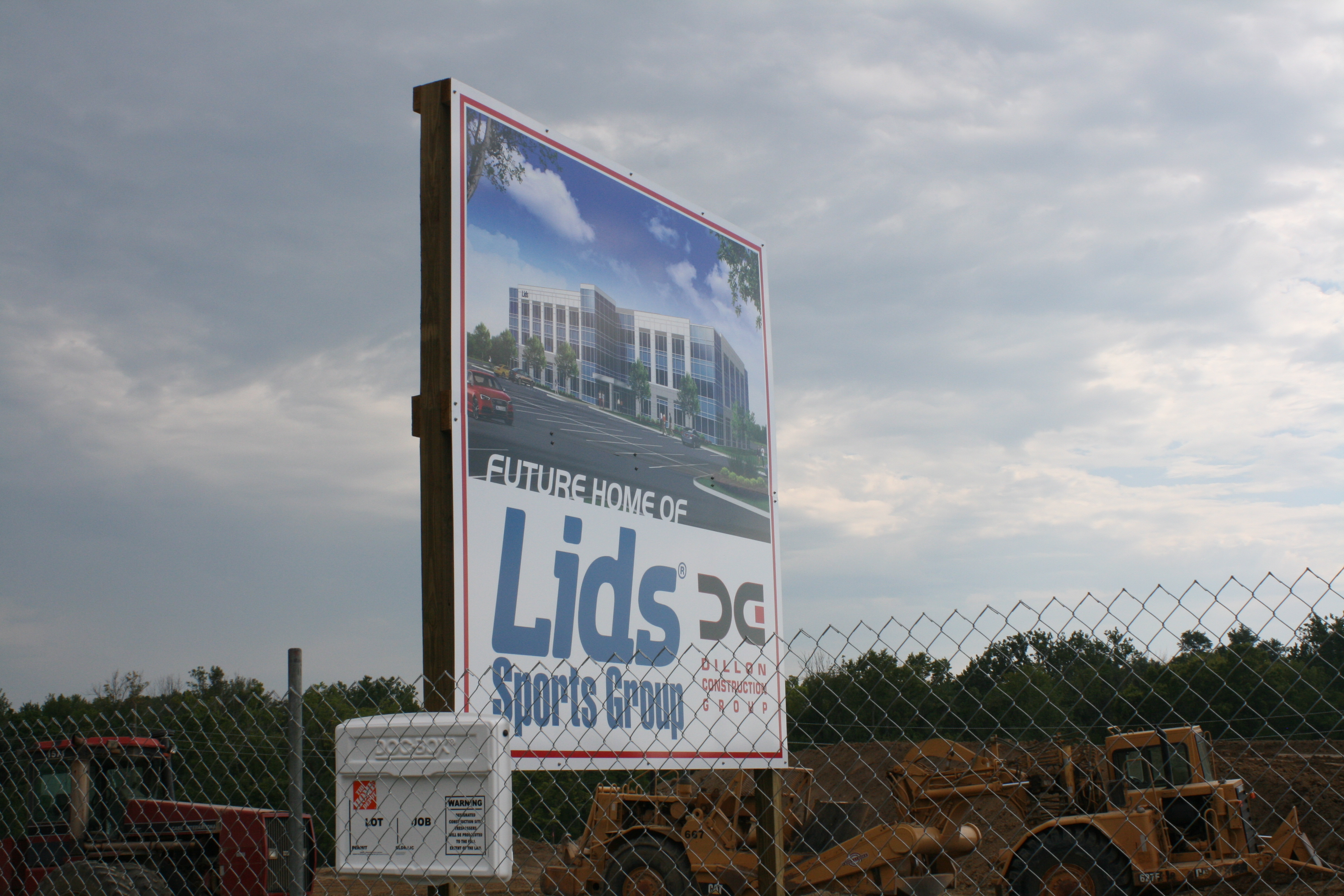A sign marking the LIDS, or Hat World LLC, development stands in the rain. The plan commission displayed considerable concern over the lack of the construction company’s communication. (Photo by Jimmy Feichtner)