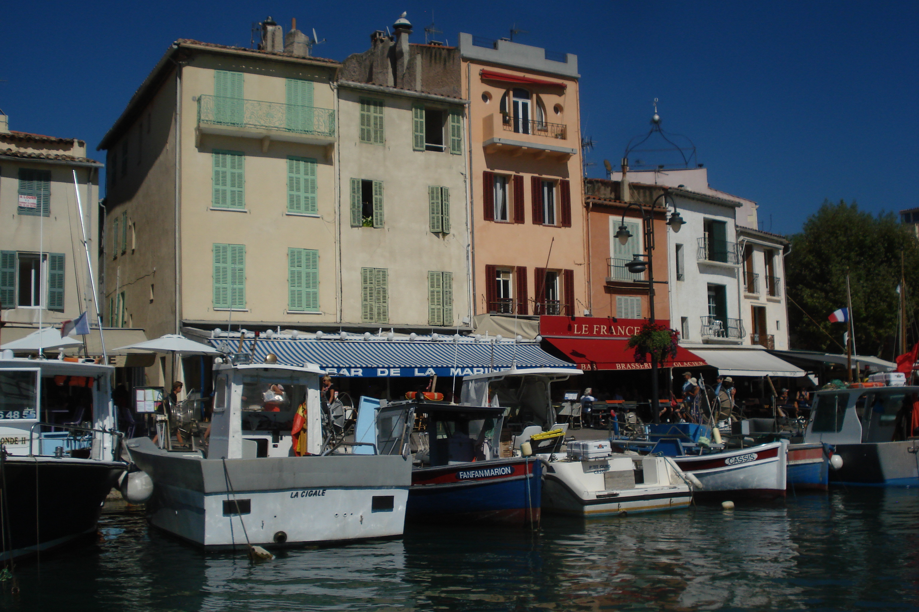The Cassis, France, port is full of activity, with fishing boats and tourist vessels vying for position. (Photo by Lana Bandy)